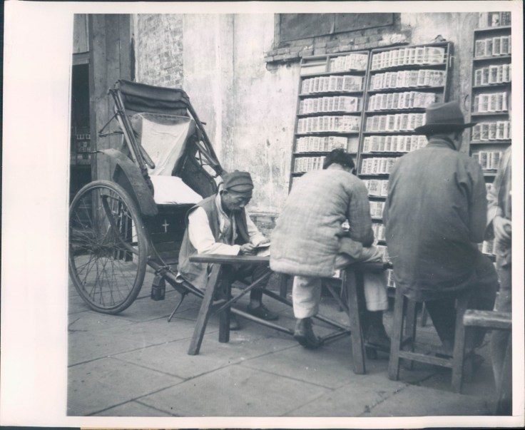 Working class patrons of a stall selling sequentially illustrated martial arts novels.  This 1948 AP photo illustrates the importance of heroic martial arts tales in southern China, even for individuals with limited literacy.