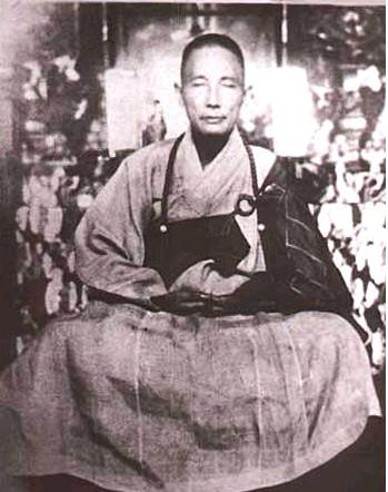 Cheung Lai Chuen, dressed in Buddhist robes.
