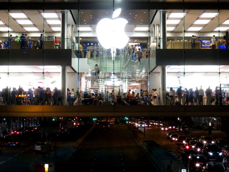 Young adults packed into the Apple Store in the International Finance Center Mall, Hong Kong 2012.