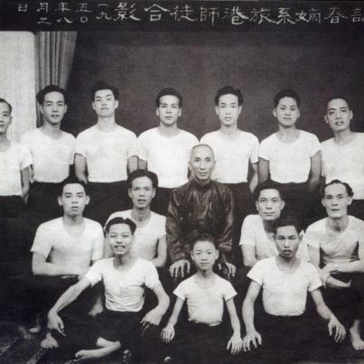 Ip Man and an early group of students in the 1950s.  In many ways Ip Man represents the fundemental paradox of the modern martial art's quest for authenticity.  He was an undenibaly genuine and talented local martial artist, yet he is current being infused back into Chinese martial culture through the medium of almost entirely fictional films.
