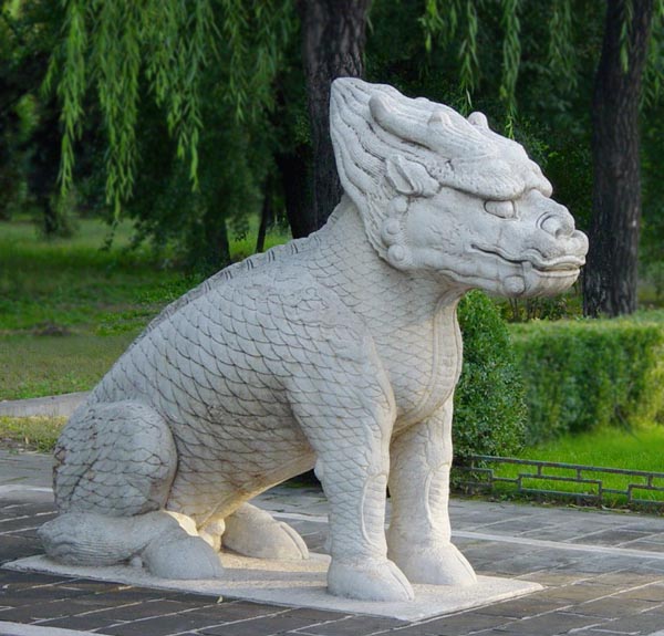 A statue of a Qilin preserved among the Ming Tombs.  this creature shows distinctive dragon and fish characteristics and it clearly hoofed.  Source: wikimedia. 