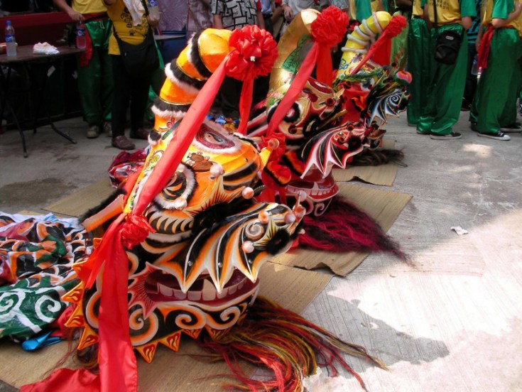 Three Qilin heads, at a 2006 Monkey God festival in Hong Kong. Photo credit: Sam Judkins.