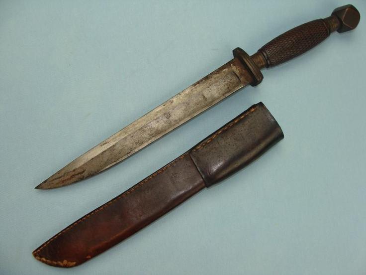 A very unusual Chinese fighting knife.  This piece is made from a modified US military saber blade, reshaped and mounted in a traditional Chinese style.  Late 19th century.  Source: www.swordsantiqueweapons.com