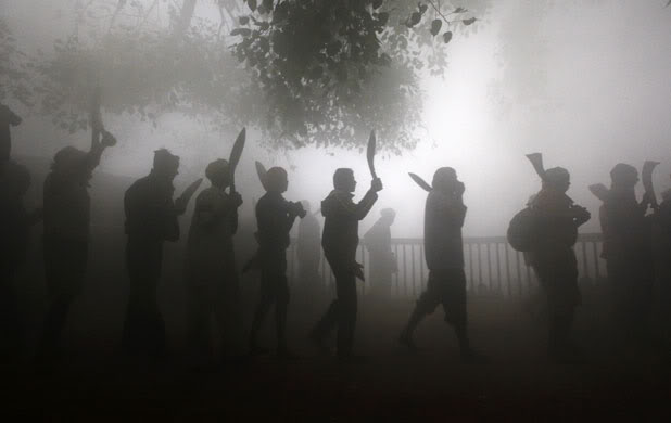 A procession of men carrying kukris and other blades to be used in the ritual slaughter of hundreds of cows to the Goddess Gadhimai.  Source: IKRHS (hat tip to Spiral), 2009.