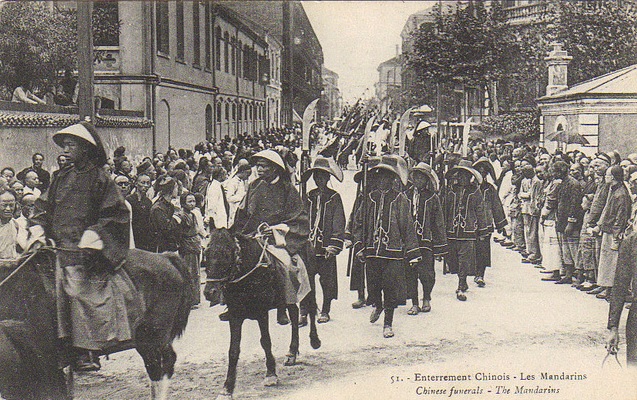 Chinese official and his retinue/staff in a procession in Shanghai (pre-1911).  Again, notice the polearms carried by his employees.  They are flashy, and possibly brightly painted, but probably not very functional.