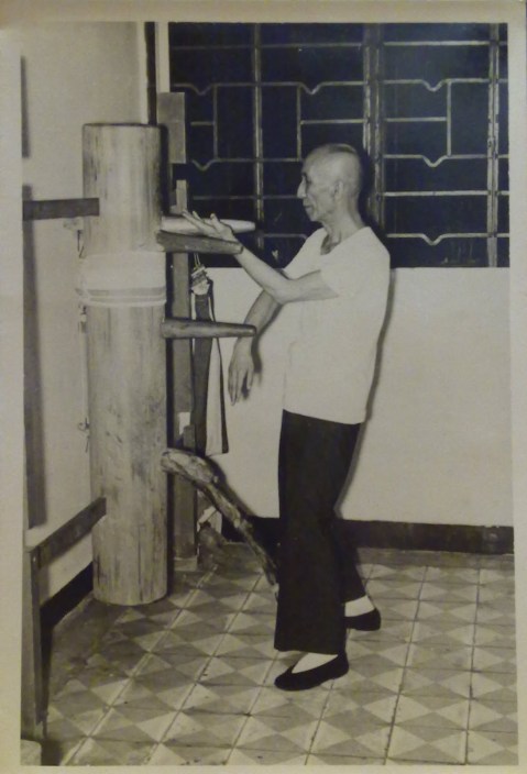 Ip Man demonstrating the wooden dummy form. Photograph was taken in 1967 by Tang Sang and is currently the property of Ip Ching.