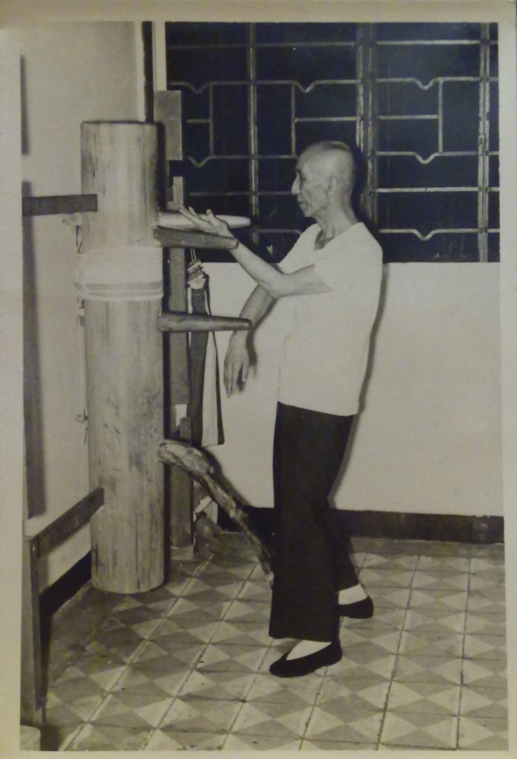 Ip Man demonstrating the wooden dummy form. Photograph was taken in 1967 by Tang Sang and is currently the property of Ip Ching.