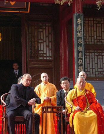 Putin watches a Kung Fu exhibition with the Abbot at the Shaolin Temple in Henan.  Shaolin has become an important stop for visiting VIPs.  Source: People's Daily.