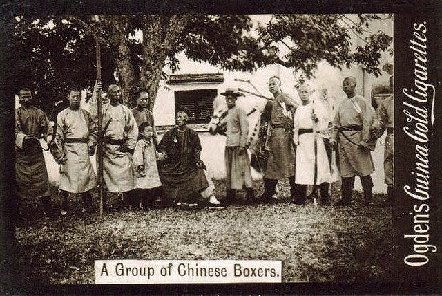 A group photograph of an archery class or society.  Ogden Cigarette Card, circa 1901.
