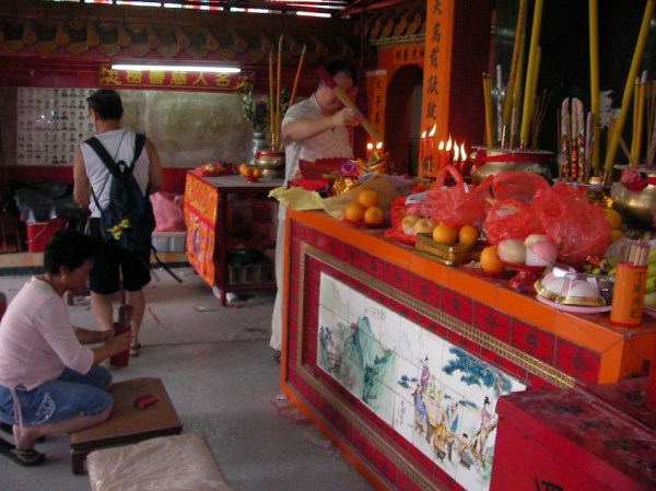 Women offering prayers and incense at the Monkey God Festival, 2006.  source: Photo by Samuel Judkins.