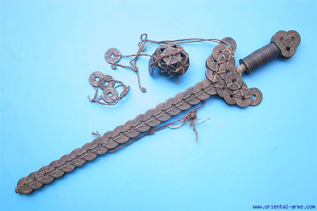 A late 19th Century Guardian Sword made of period coins.  Such talisman were used as protective magical weapons.  Source:  