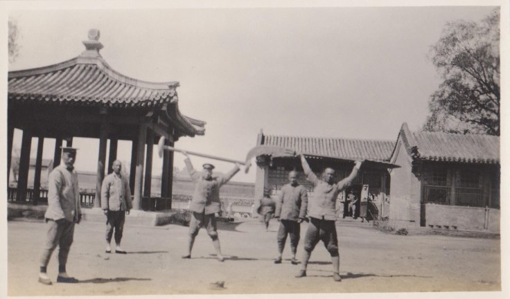 A vintage photograph showing Republic era army troops at the Winter Palace in Beijing posing with Stone Wheels and a Wukedao (Heavy Knife).  Source: Author's personal collection.