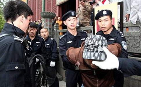 Members of the new anti-terrorism team demonstrating the arrest of a suspect.  Source: www.scmp.com