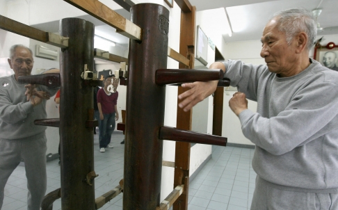 Ip Chun practices the dummy form at the age of 90. Source: Dickson Lee, SCMP.