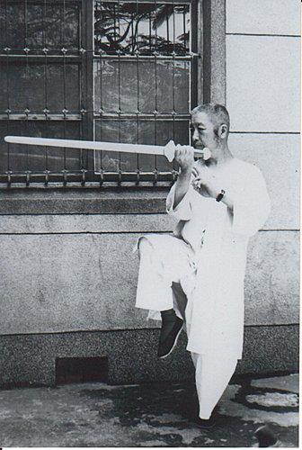 Zheng Manqing with sword, possibly on the campus of Columbia University in New York City.
