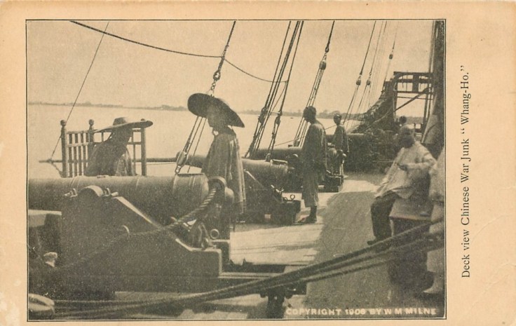 Vintage postcard showing Chinese sailors at the cannons of the War Junk Whang Ho. Note Milne's copyright on the lower right.  Source: Author's personal collection.