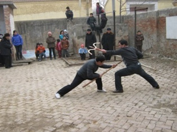 Mei Boxers weapons practice in Hou Zhuzhai Village (Puyang, Henan).  Source: Personal Collection of Prof. Thomas Green.