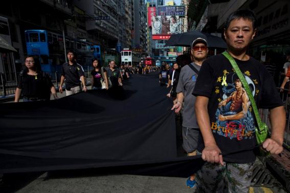 An Occupy Central Protester wears a Bruce Lee shirt. Source: http://www.reuters.com