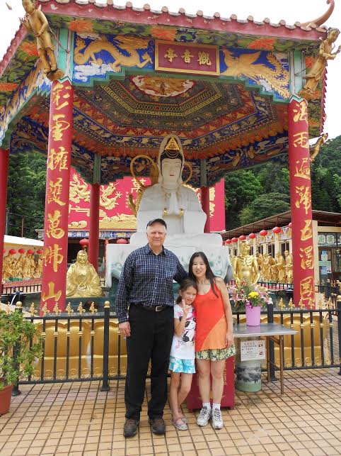 Dr. Amos, wife Yukari and daughter Himiko, at the 10,000 Buddhas Temple in Hong Kong, standing in front of Guan Yin (Goddess of Mercy), one of the gods worshipped by our martial house.  Source: Amos' personal collection.