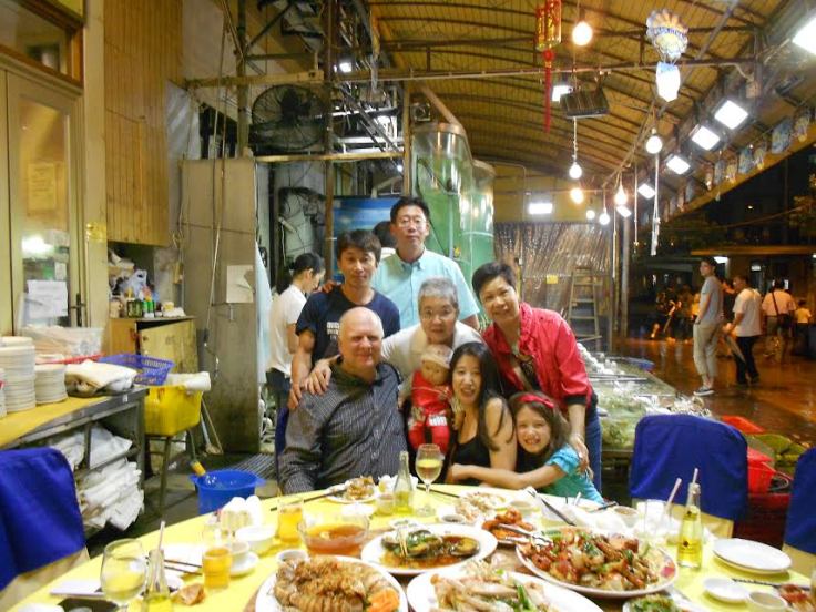 Martial sister (with arm on my shoulder) and martial brother (tallest person standing in the rear of the photo), consuming seafood with their and my family members and friends.  Both have followed the master since childhood, and my martial sister is a member of the master's patriline.   My martial brother in the photo serves as the master's teaching assistant. He is a policeman, a common occupation for someone from Hong Kong's New Territories with little education.  Although he did not receive much education, his son is a graduate of an Ivy League school in the U.S. and currently works for an international banking firm in Hong Kong.  His son is also a capable martial artist, and considered a follower of the master.   Source: Amos' Personal Collection. 