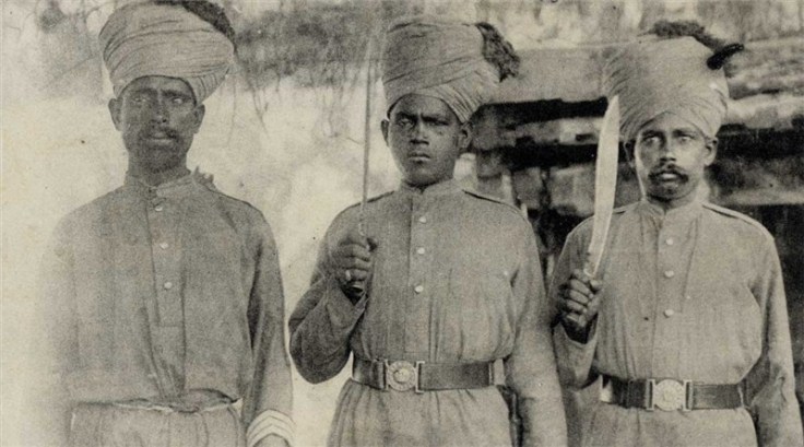 Another photograph, often labeled "Indian Troops in France" which features the same individual. You can see the profile of his knife blade better in this shot, strongly suggesting that his weapon is the variant of the MKI service kukri that was produced at Fort William. Source: Old Indian Photos (Public Domain).
