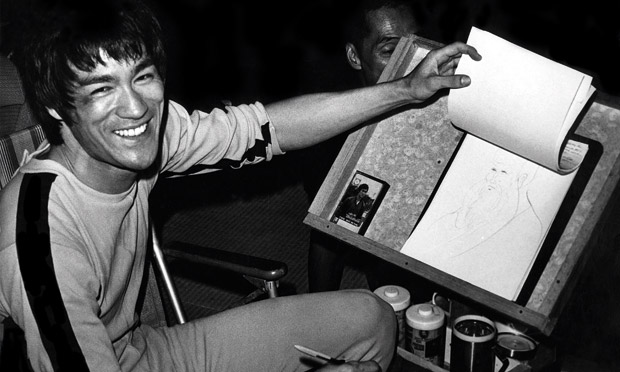Bruce Lee sketching on the set for Game of Death. Photograph: Bruce Lee Estate. Source: The Guardian.
