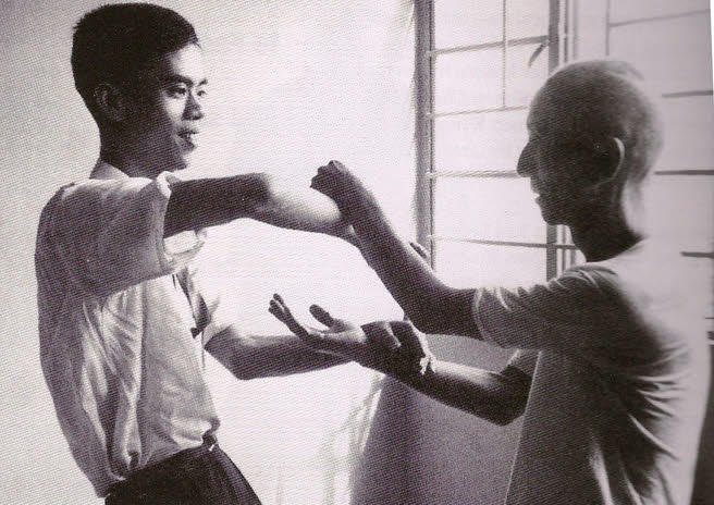 Ip Man practices Chi Sao With Moy Yat.