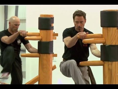 Robert Downey Jr. and Eric Orem working on the wooden dummy.