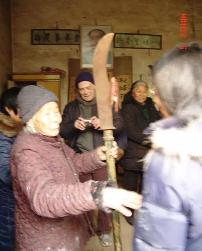 A snapshot of Master Zheng as she shares the history of her art.  Source: From the private collection of Thomas A. Green.