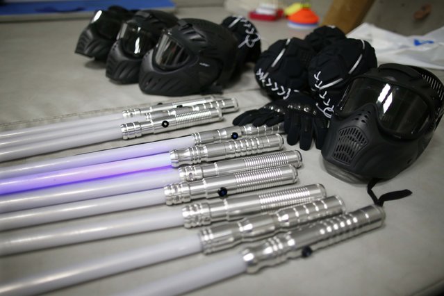 Stunt sabers and helmets at a Paris lightsaber tournament. Photo by Charles Platiau. Source: http://avax.news 