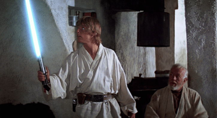 Luke receiving his fathers lightsaber in Episode IV: A New Hope (1977).