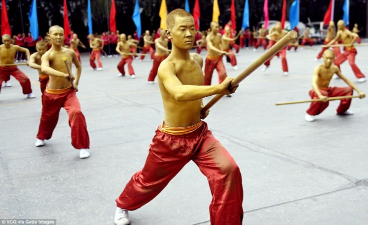 Shaolin's famous bronze men, as reimagined for a public performance.  Source: The Daily Mail.